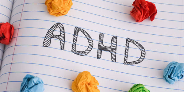 Word ADHD written on a sheet of paper